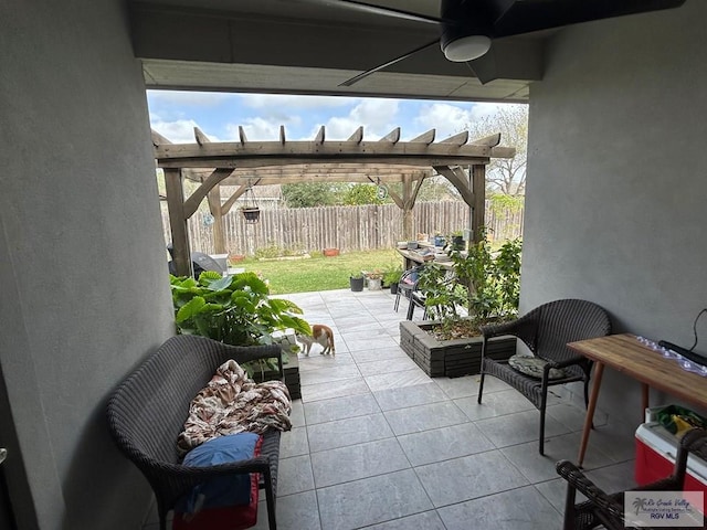 view of patio / terrace featuring fence, a ceiling fan, and a pergola