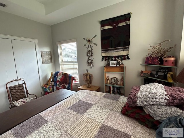 bedroom featuring a closet and visible vents