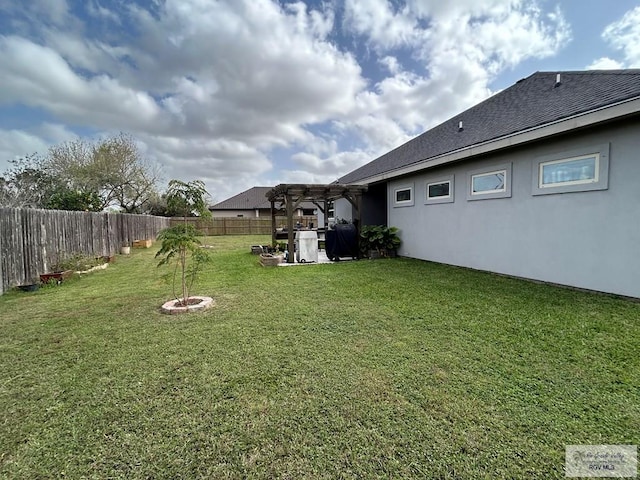 view of yard featuring a fenced backyard and a pergola