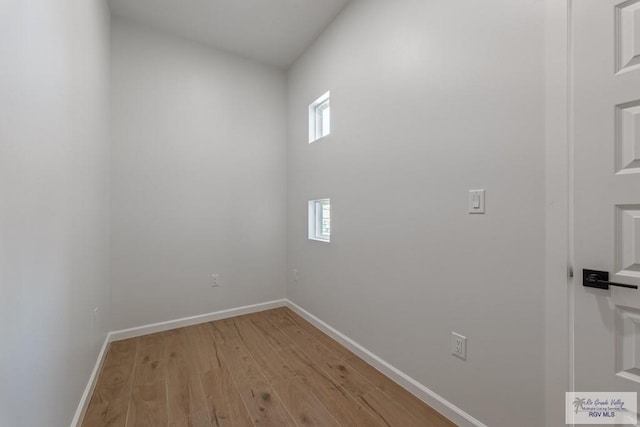 spare room with light wood-type flooring