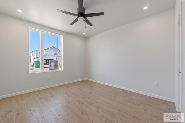 unfurnished room featuring light hardwood / wood-style floors and ceiling fan