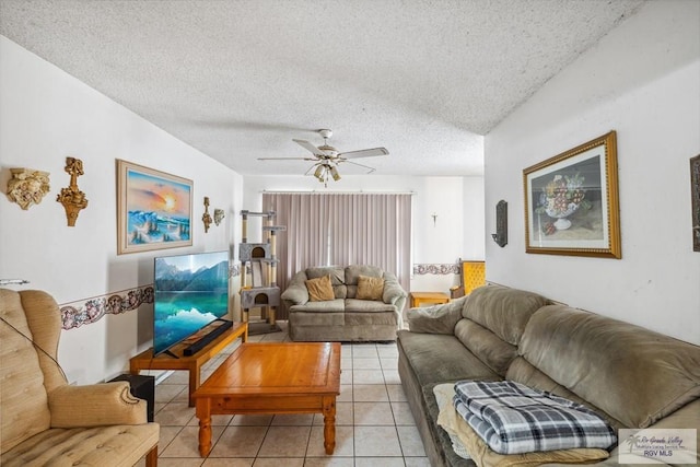 734 Billy Mitchell Blvd, Brownsville, TX 78521 - living room featuring light tile patterned floors, a textured ceiling, and a ceiling fan