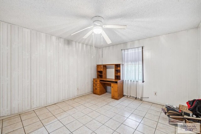 734 Billy Mitchell Blvd, Brownsville, TX 78521 - spare room with ceiling fan, a textured ceiling, an office area, and light tile patterned floors