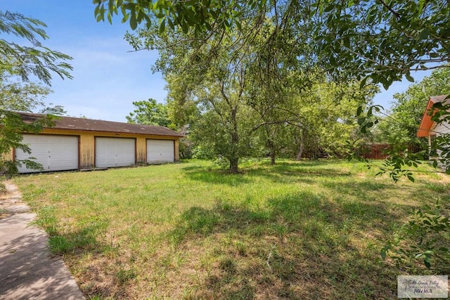 734 Billy Mitchell Blvd, Brownsville, TX 78521 - view of yard featuring a detached garage