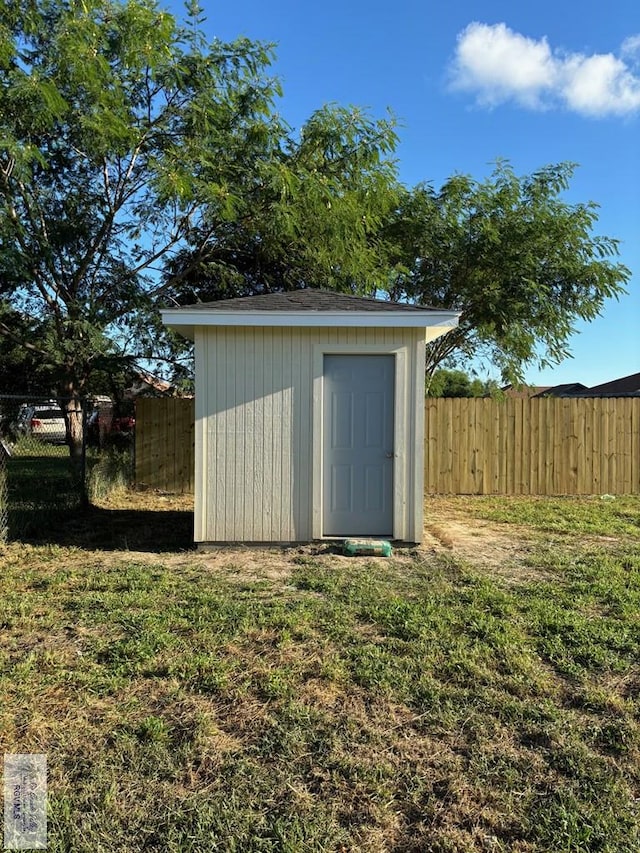 view of outdoor structure with a lawn