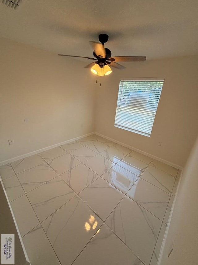 empty room featuring ceiling fan