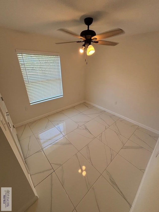 unfurnished room featuring ceiling fan