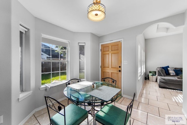 dining area with light tile patterned floors