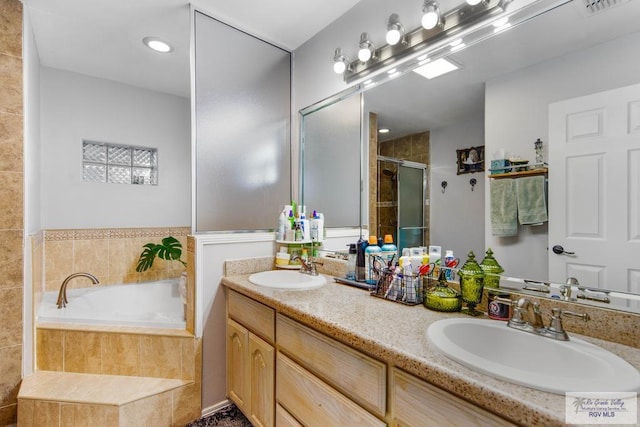 bathroom featuring vanity and plus walk in shower