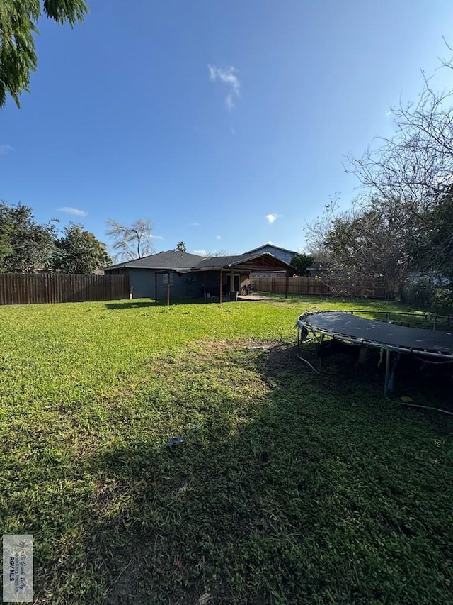 view of yard featuring a trampoline