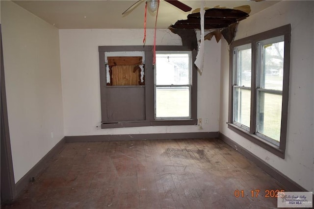 unfurnished room featuring ceiling fan and wood-type flooring