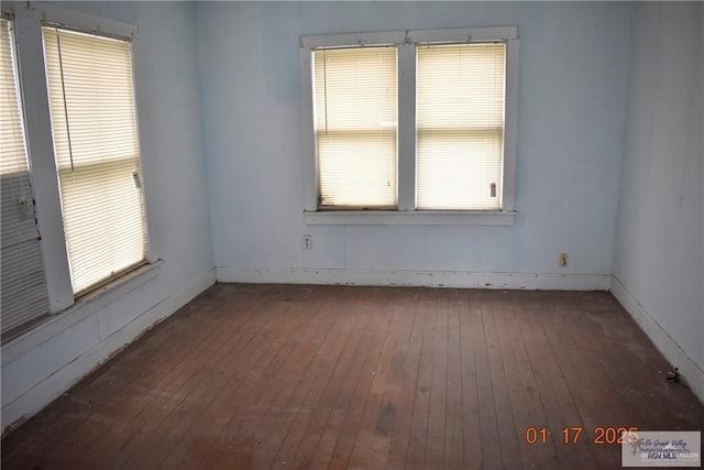 spare room featuring dark hardwood / wood-style floors