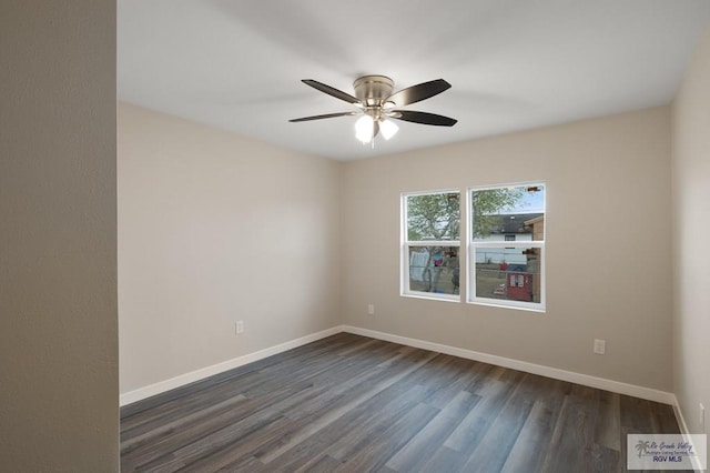 empty room with ceiling fan and dark hardwood / wood-style floors