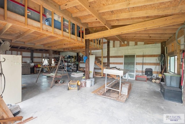 31660 Fm 1575, Los Fresnos, TX 78566 - miscellaneous room featuring unfinished concrete flooring and stairway
