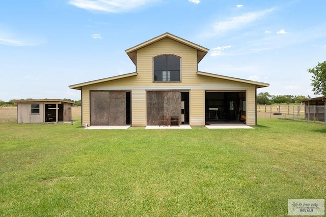 31660 Fm 1575, Los Fresnos, TX 78566 - rear view of property featuring an outdoor structure, a barn, and a detached garage