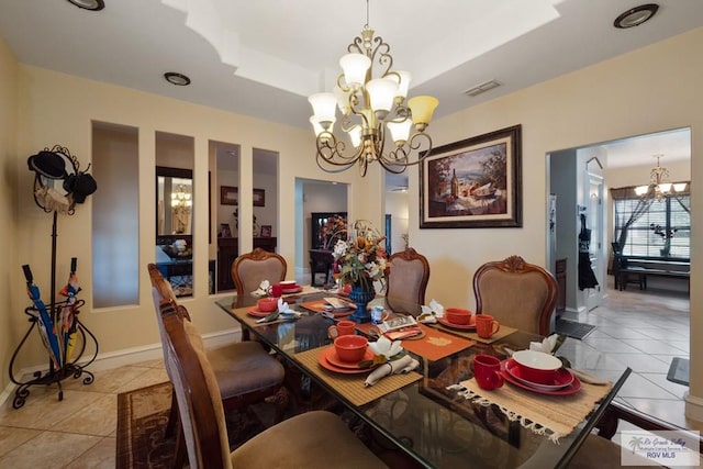 31660 Fm 1575, Los Fresnos, TX 78566 - dining space featuring a chandelier, light tile patterned flooring, and baseboards