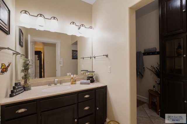 31660 Fm 1575, Los Fresnos, TX 78566 - bathroom featuring vanity, tile patterned floors, and baseboards