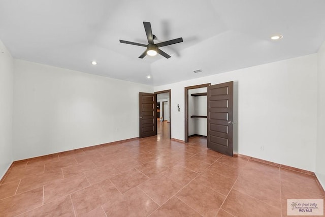 2307 Carlos Ave, Brownsville, TX 78526 - unfurnished bedroom with recessed lighting, a spacious closet, visible vents, and light tile patterned flooring