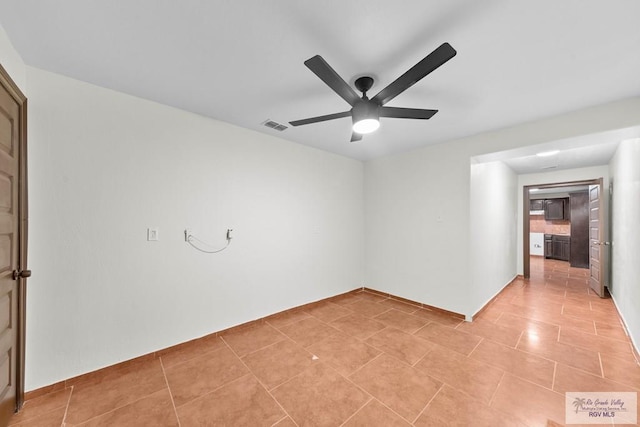 2307 Carlos Ave, Brownsville, TX 78526 - empty room with visible vents, ceiling fan, and light tile patterned floors