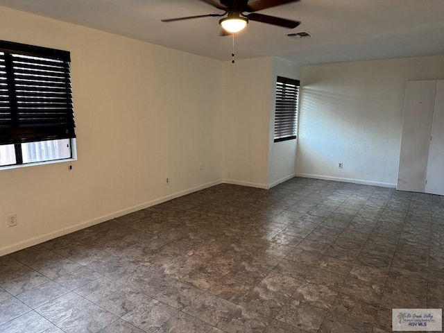 empty room featuring ceiling fan