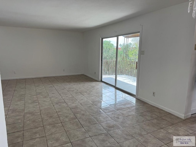 empty room with light tile patterned flooring