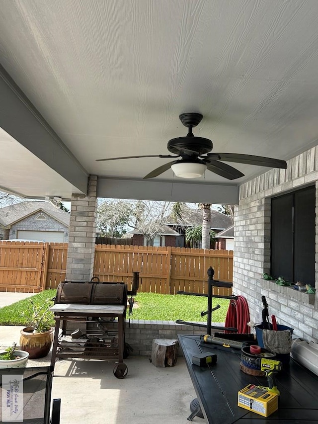 view of patio featuring area for grilling and ceiling fan