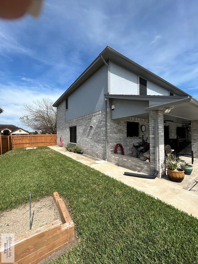 exterior space featuring a patio and a lawn