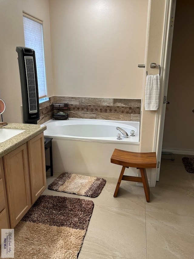 bathroom with vanity and a tub