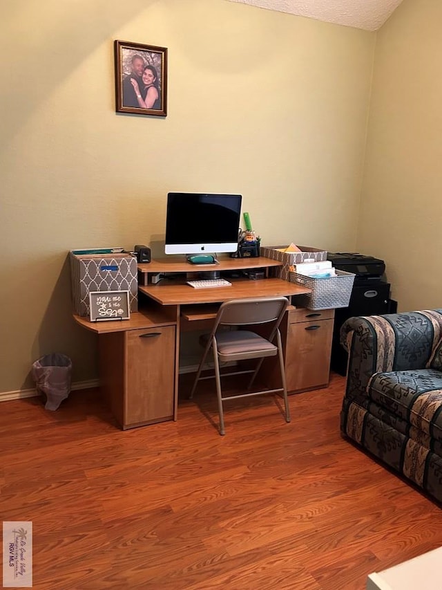 office with light hardwood / wood-style floors