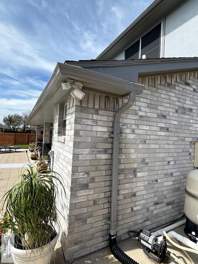 view of property exterior with a patio