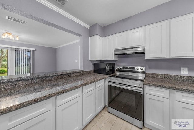 kitchen featuring white cabinets, ornamental molding, stainless steel electric range oven, and dark stone counters