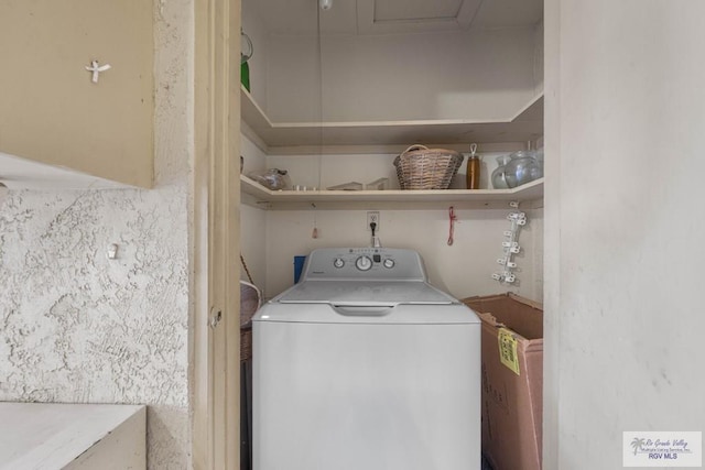 washroom featuring washer / clothes dryer