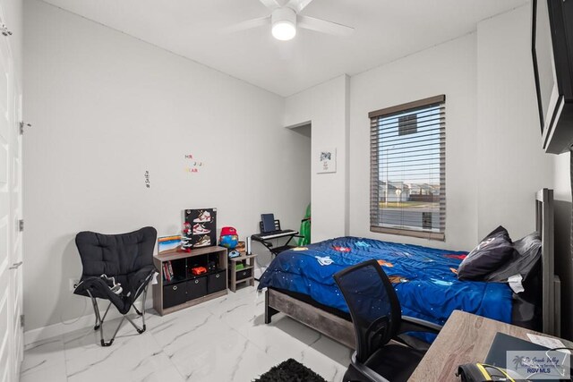 122 Heron Dr, Los Fresnos, TX 78566 - bedroom with marble finish floors and a ceiling fan
