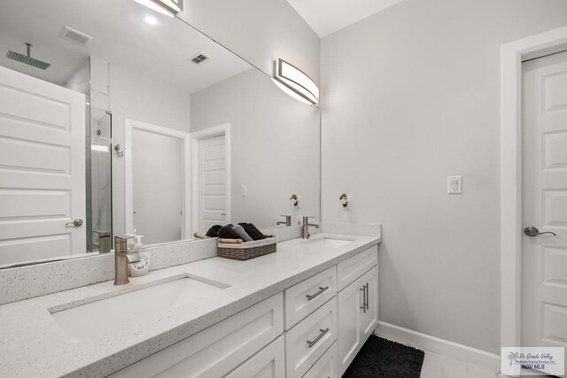 122 Heron Dr, Los Fresnos, TX 78566 - full bath with double vanity and a stall shower