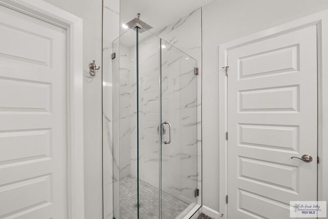 122 Heron Dr, Los Fresnos, TX 78566 - bathroom with a marble finish shower