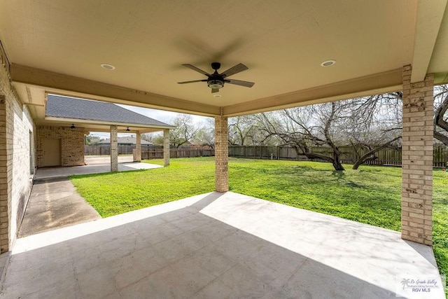 view of patio featuring ceiling fan