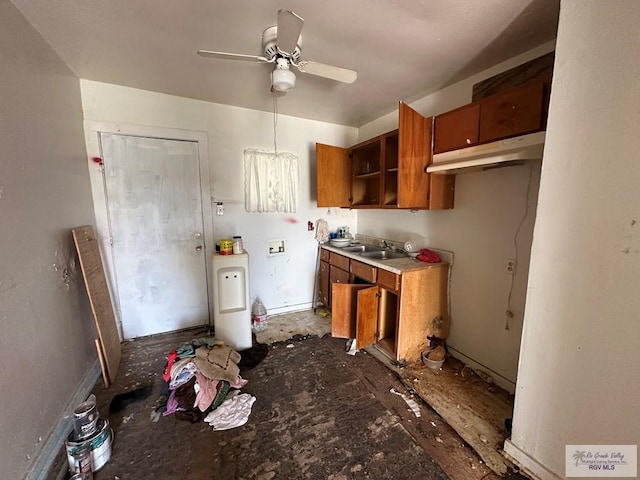 kitchen featuring ceiling fan and sink