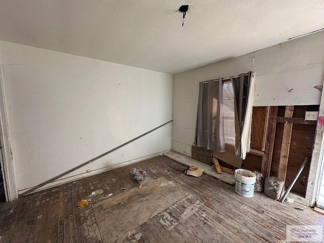 miscellaneous room with a textured ceiling