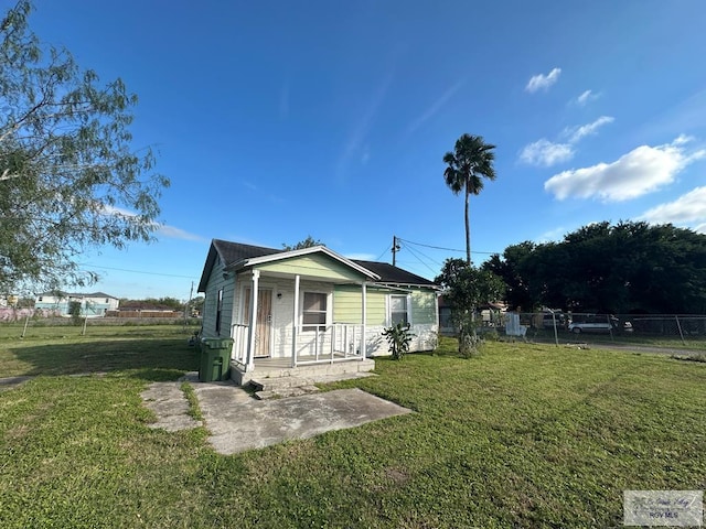 view of front of home featuring a front lawn and a porch