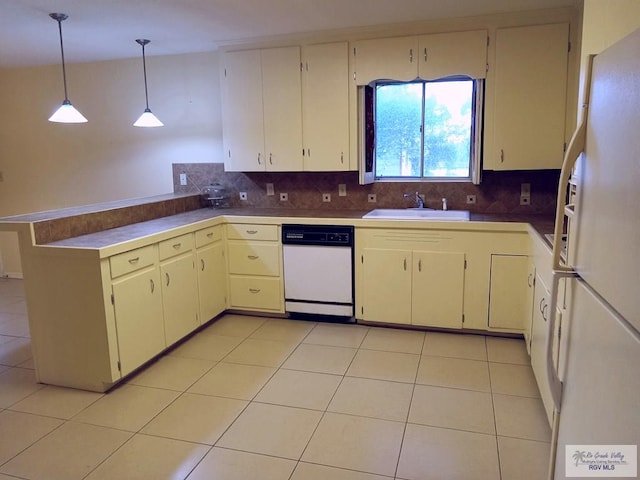 kitchen featuring backsplash, white appliances, sink, pendant lighting, and light tile patterned floors