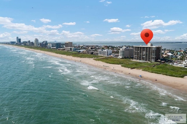 birds eye view of property with a view of the beach and a water view