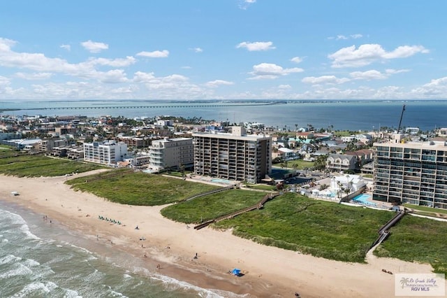 aerial view with a water view and a view of the beach