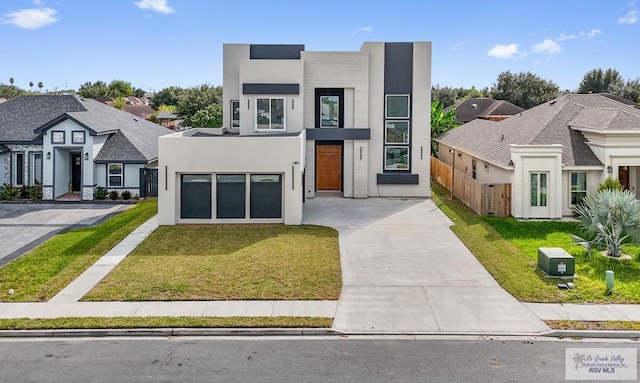 modern home featuring a front lawn