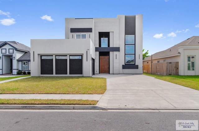 contemporary home featuring a front lawn