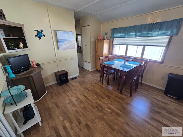 dining room featuring dark wood-type flooring