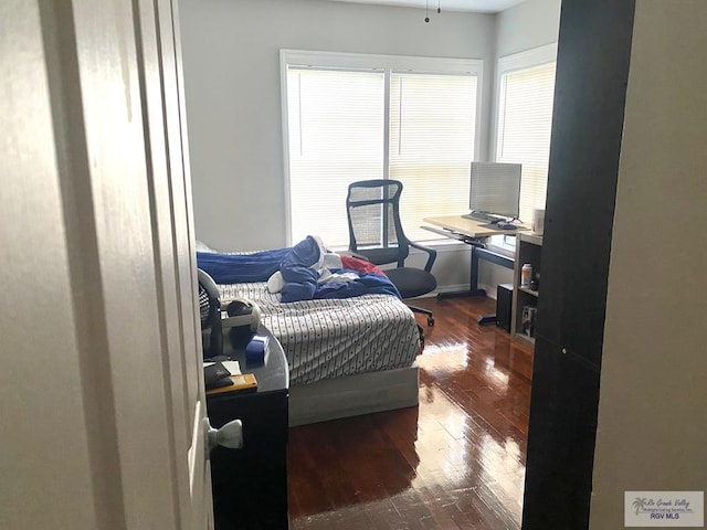 bedroom featuring dark wood-type flooring