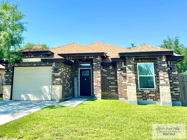 2901 Tree Top Ct, Harlingen, TX 78552 - view of front of property featuring a garage, driveway, a front lawn, and brick siding