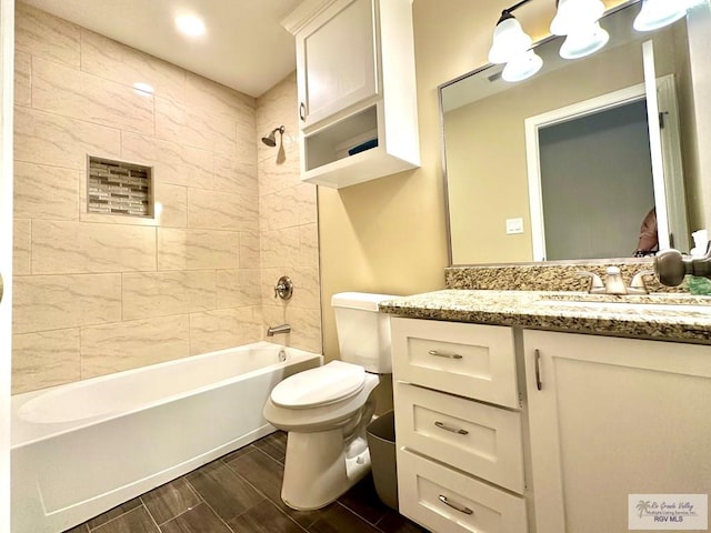 2901 Tree Top Ct, Harlingen, TX 78552 - full bath featuring shower / tub combination, toilet, vanity, and wood finish floors