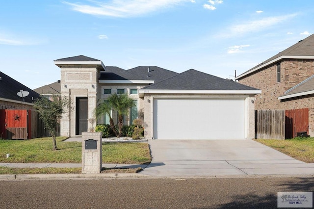 1903 W Webster Dr, Edinburg, TX 78542 - view of front of house with driveway, an attached garage, and brick siding