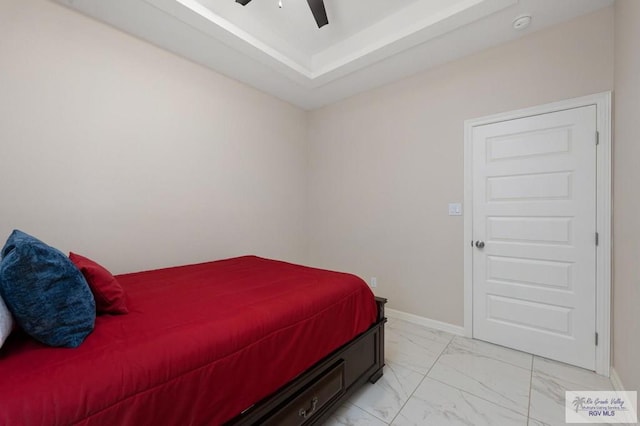 1903 W Webster Dr, Edinburg, TX 78542 - bedroom featuring light marble finish flooring, ceiling fan, and a raised ceiling